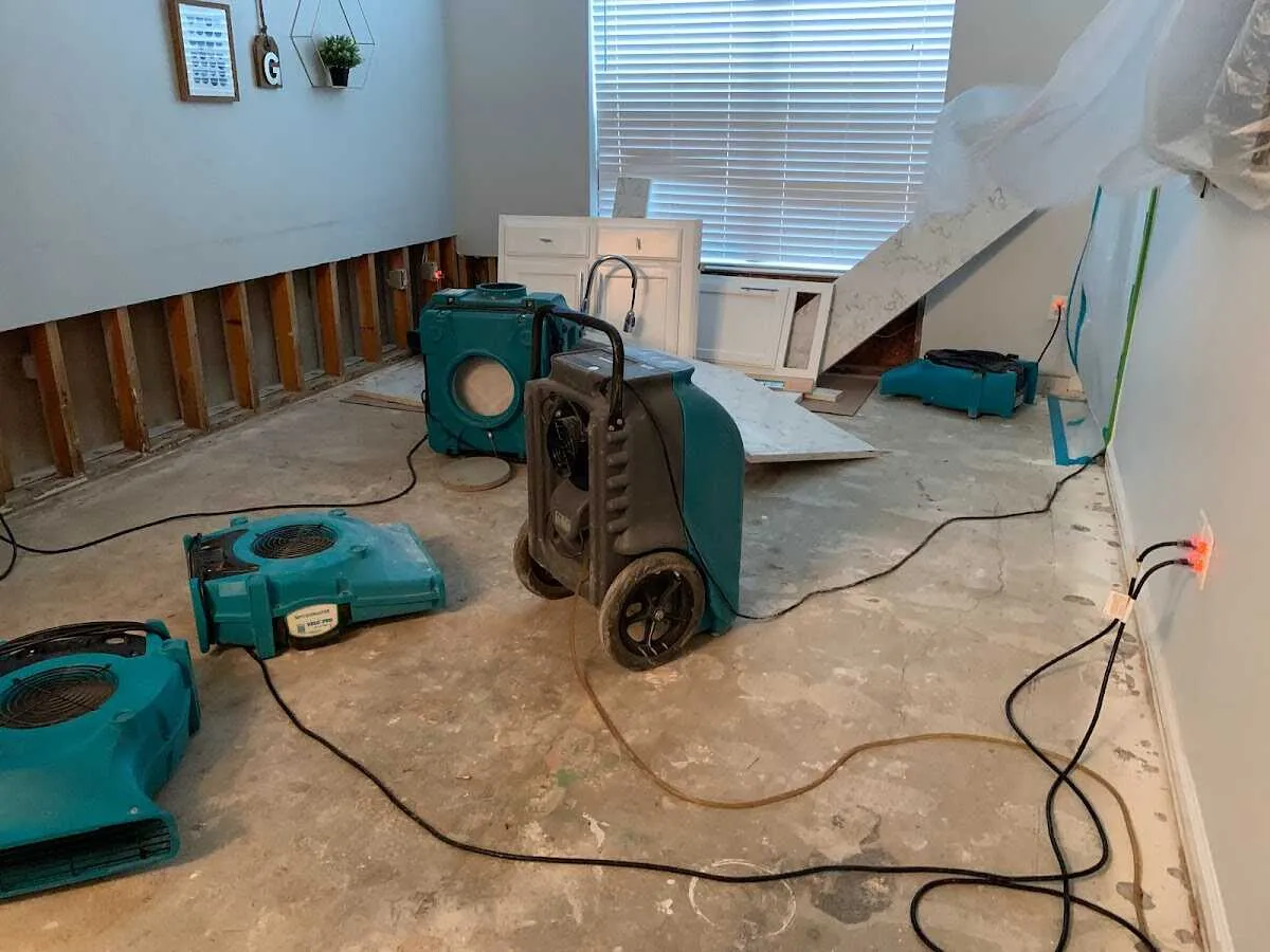 Dehumidifier in flood-cut room for Water Damage Restoration in White City
